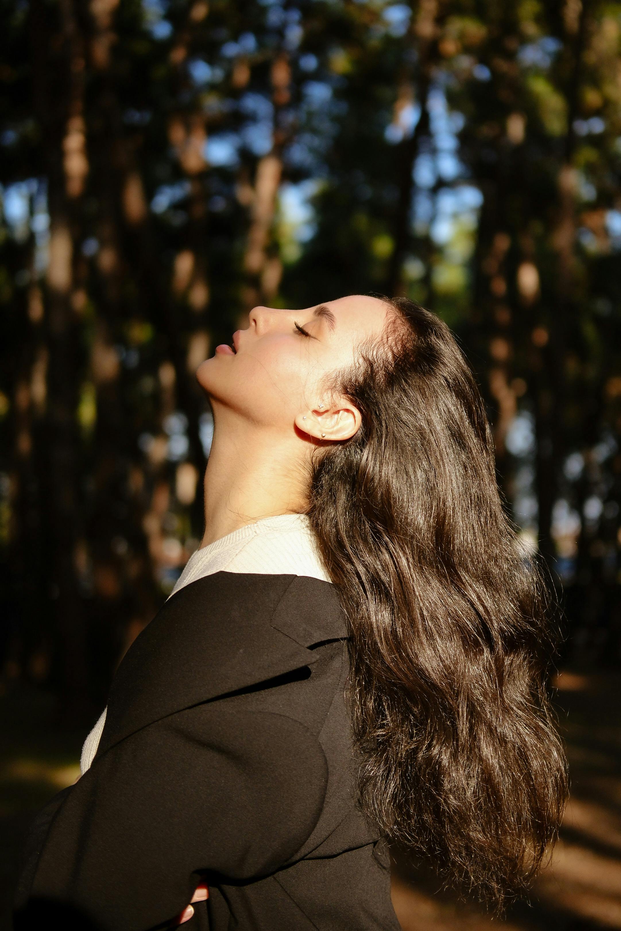 a woman with long hair is looking up
