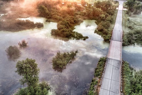 Aerial Photo with a Bridge Crossing Wetlands at Dawn