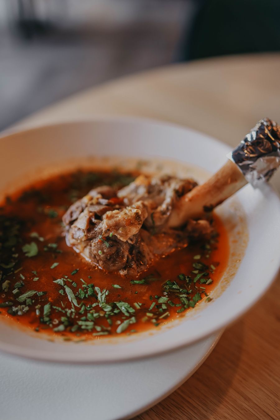 Lamb shank in a rich spiced sauce with herbs