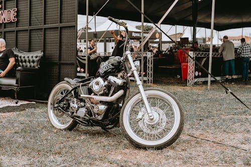 A Black Harley-Davidson Motorcycle at a Motorcycle Event 
