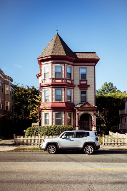 Beautiful Victorian house with vintage architecture in a quiet suburban street.