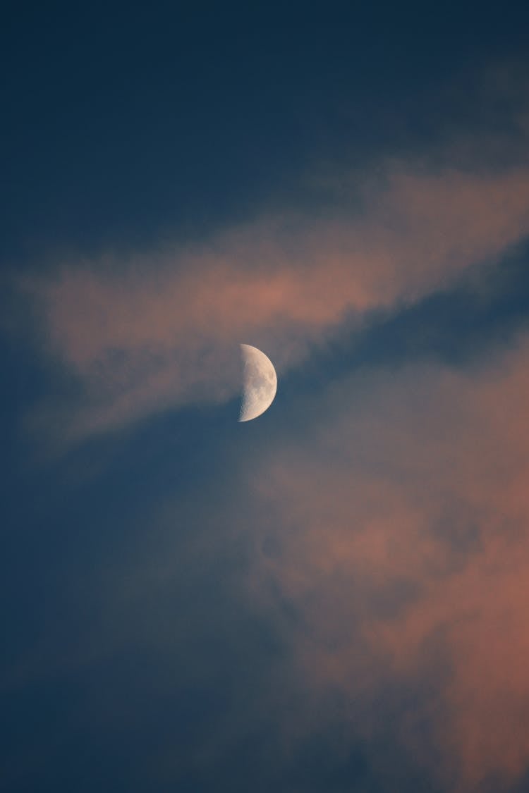 Moon In Crescent Behind Clouds