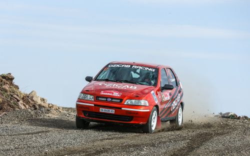 Free Fiat car participating in a rally race on a gravel track in Ankara, Türkiye. Stock Photo
