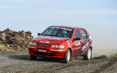 Free Fiat Palio rally car making a sharp turn on a gravel track in Beynam, Ankara, Türkiye. Stock Photo