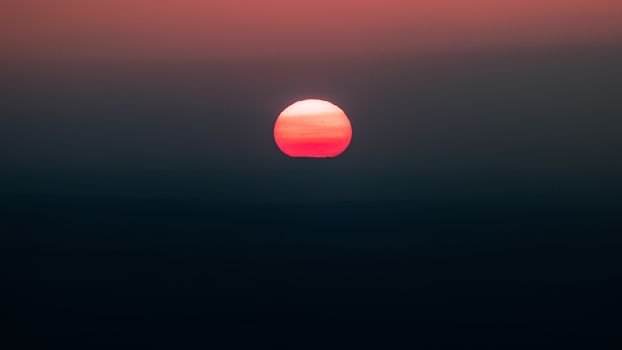 Captivating sunset with vivid colors marking the horizon, casting a magical glow.