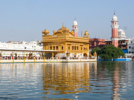 Beautiful view of the Golden Temple reflecting in the water in Amritsar, Punjab, India.