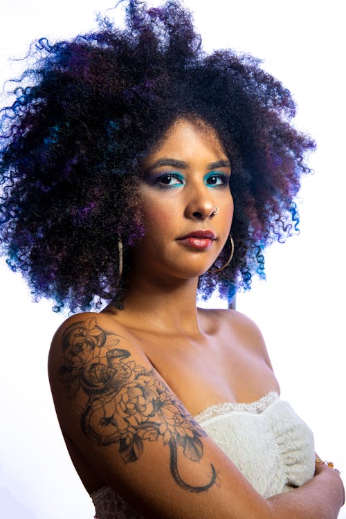 Beautiful Woman with Afro Hair Posing in Studio