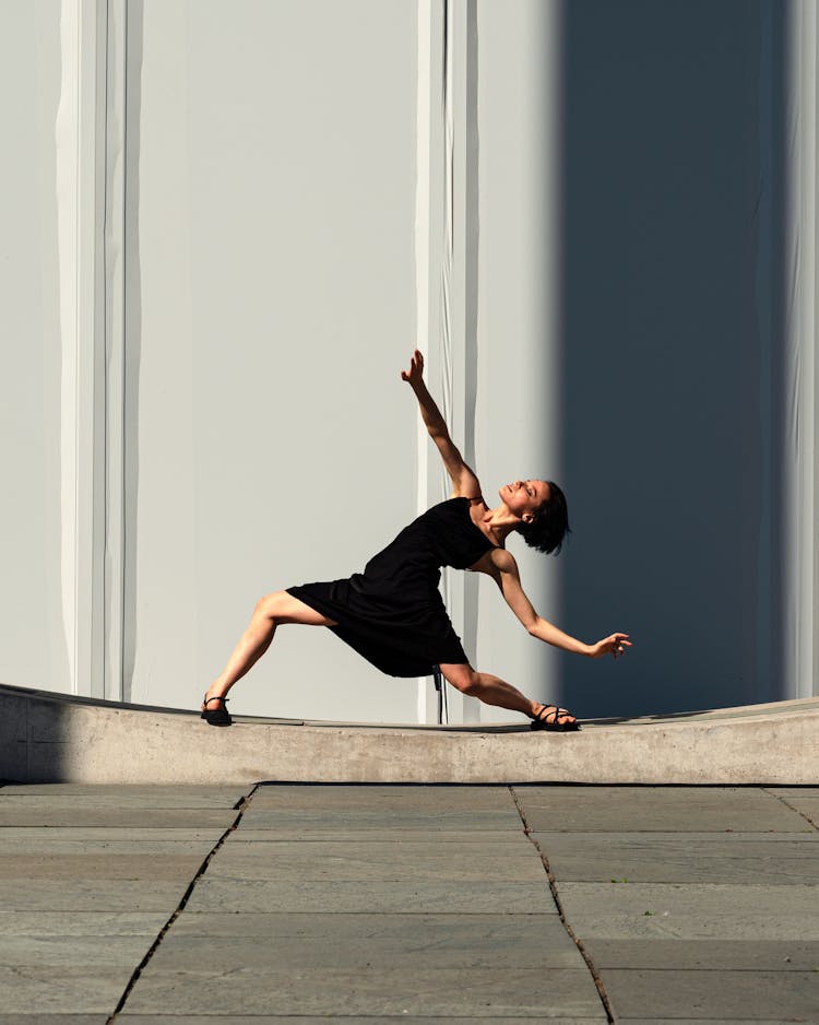 Female Dancer Posing On The Pavement