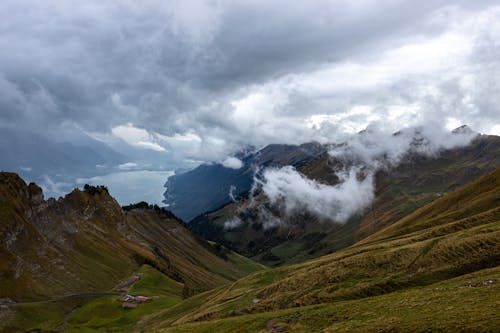 Landscape of Mountains under a Cloudy Sky 