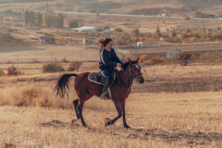 Woman Riding Horse