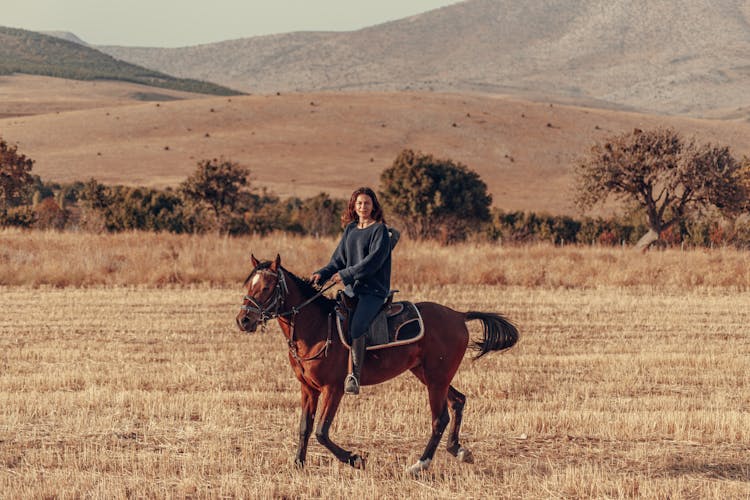 Woman Riding Horse