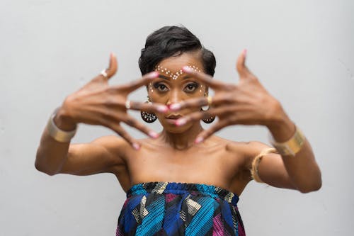 Portrait of a Female Model Posing against a White Background