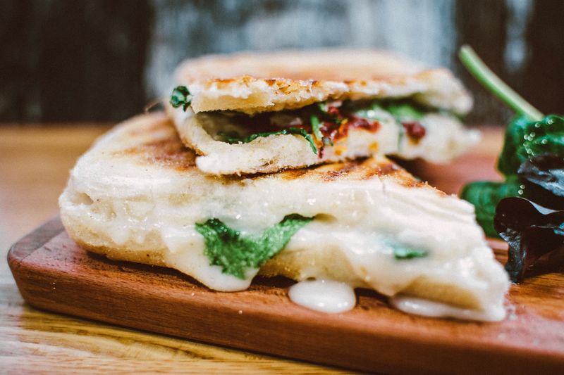open-faced tuna melt on toasted bread with melted cheese