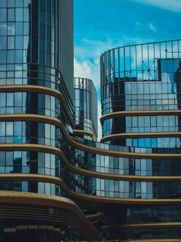 Vertical shot of futuristic skyscrapers with sleek glass facades in Minsk, Belarus.