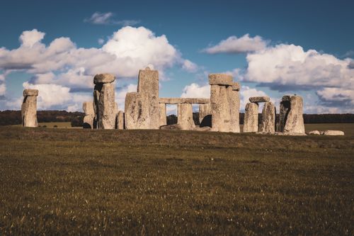 Free Iconic Stonehenge on Salisbury Plain, featuring prehistoric stone circle against a dramatic sky. Stock Photo