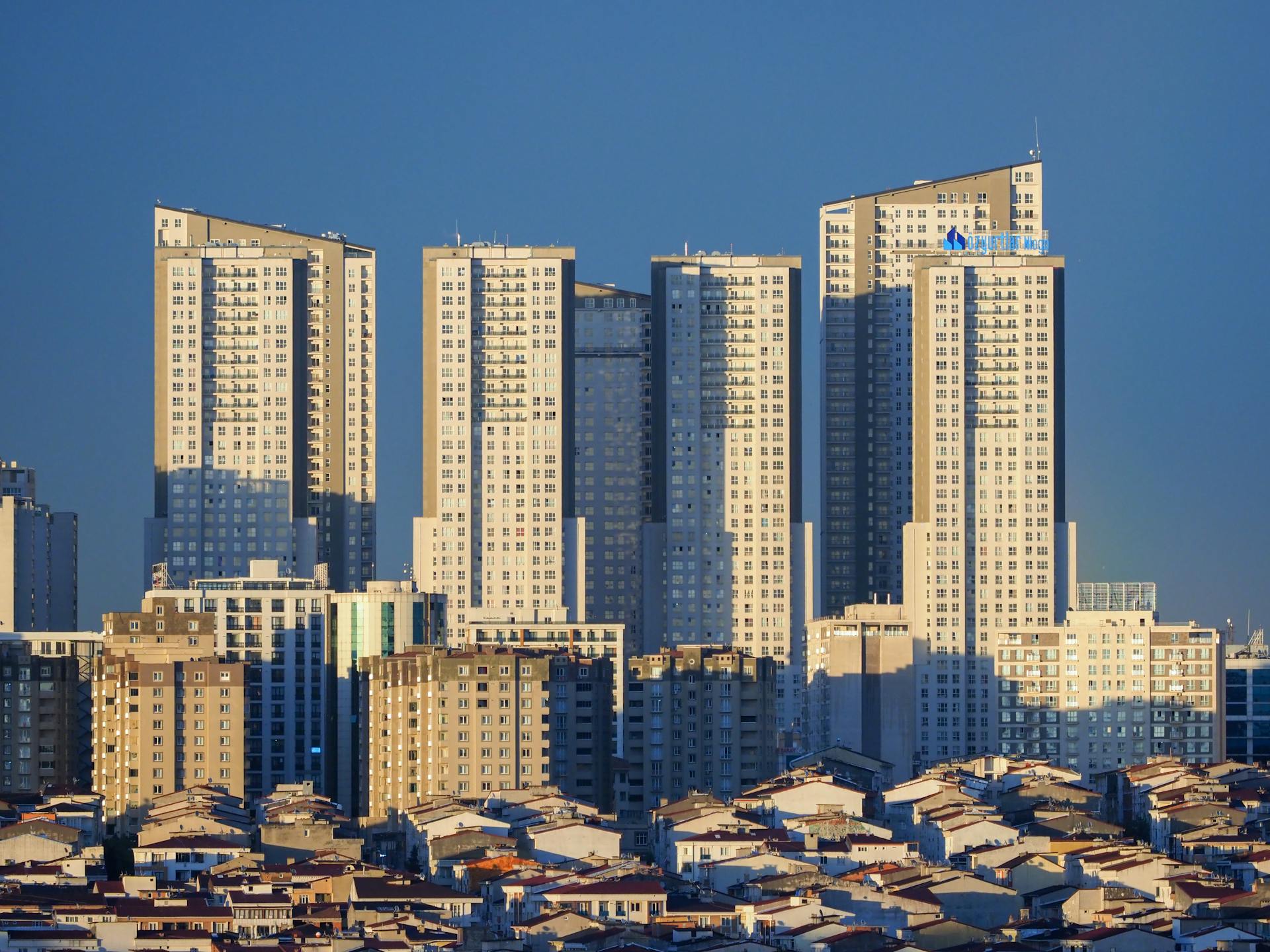 Stunning view of Istanbul skyscrapers towering over urban landscape at sunset.