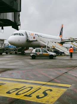 Passenger jet preparing for boarding at Orio al Serio Airport in Lombardia, Italy.