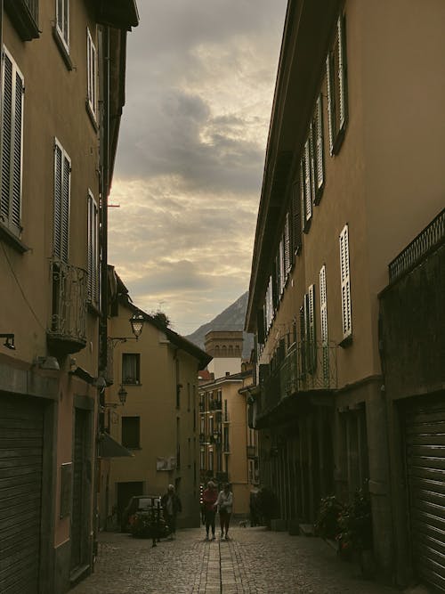 A Narrow Alley between Residential Buildings in a Town in Mountains 