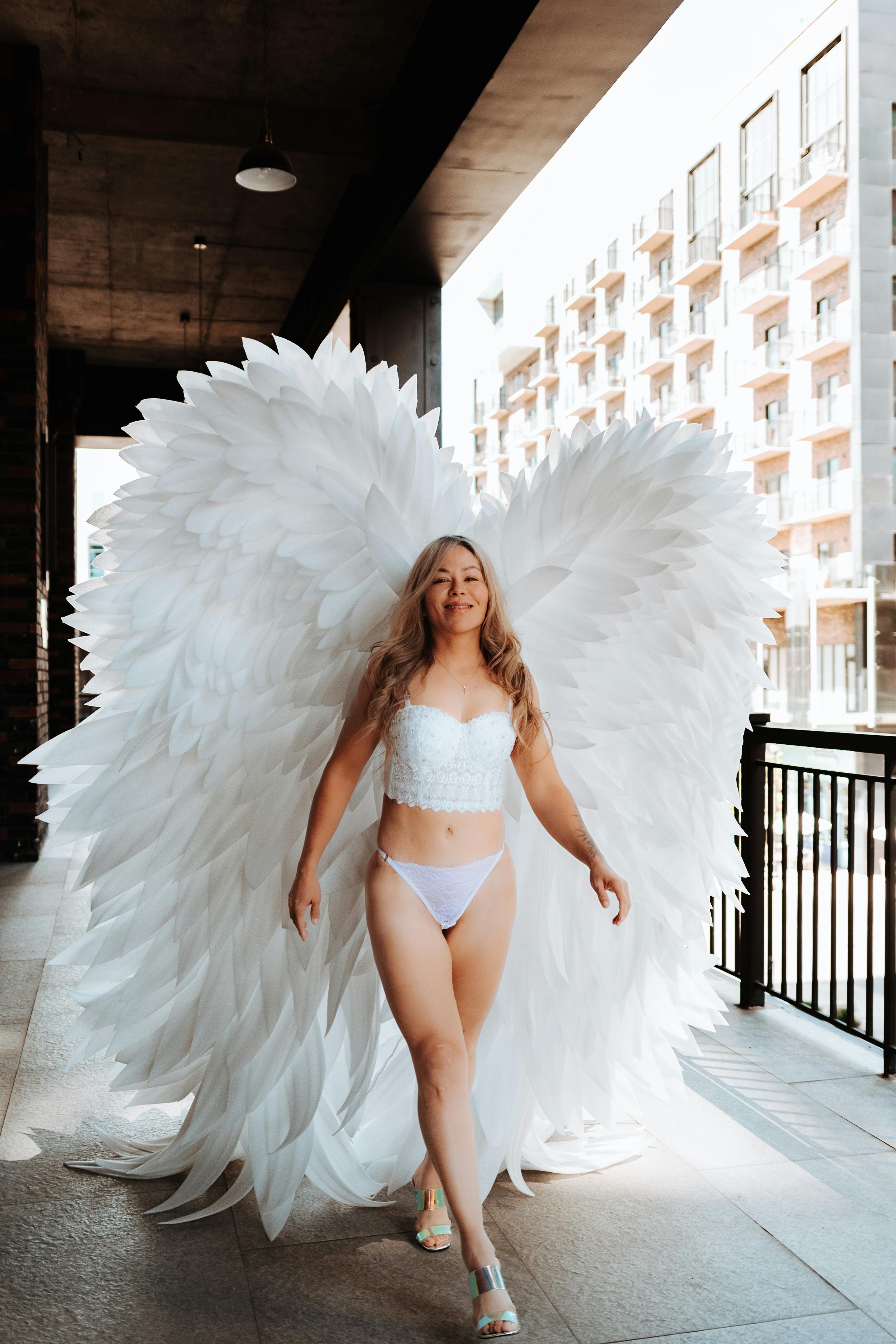 Blonde Model with Angel Wings in White Lingerie Free Stock Photo