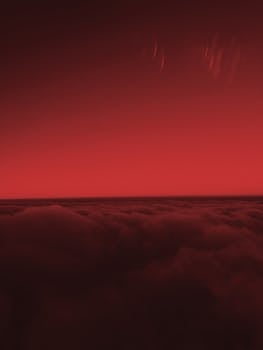 捕捉日落时分翻滚云层上方那令人惊叹的红色天空，它散发着温暖与戏剧性的气息