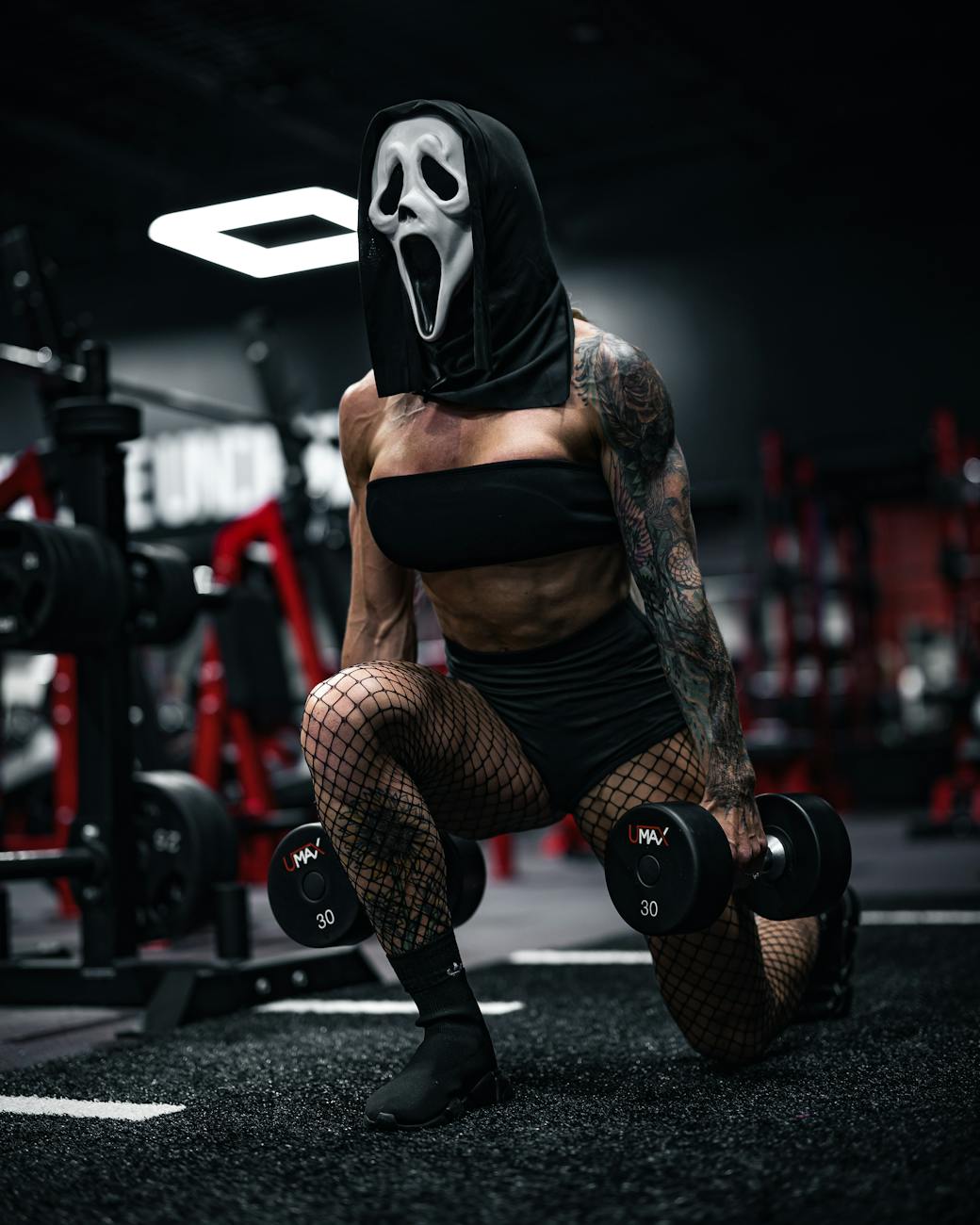 Woman smiling, performing a bodyweight squat in a bright, modern living room, focused on fitness.