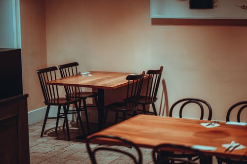 Free A minimalist restaurant interior in Tokyo featuring wooden tables and classic chairs. Stock Photo