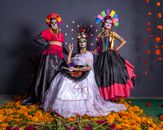 Vibrant Dia de los Muertos celebration with artistic skull makeup in Mexico City.