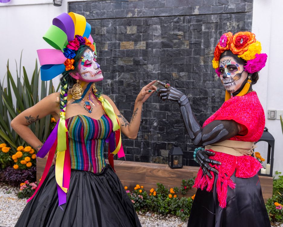 Two women dressed as day of the dead with colorful makeup · Free Stock