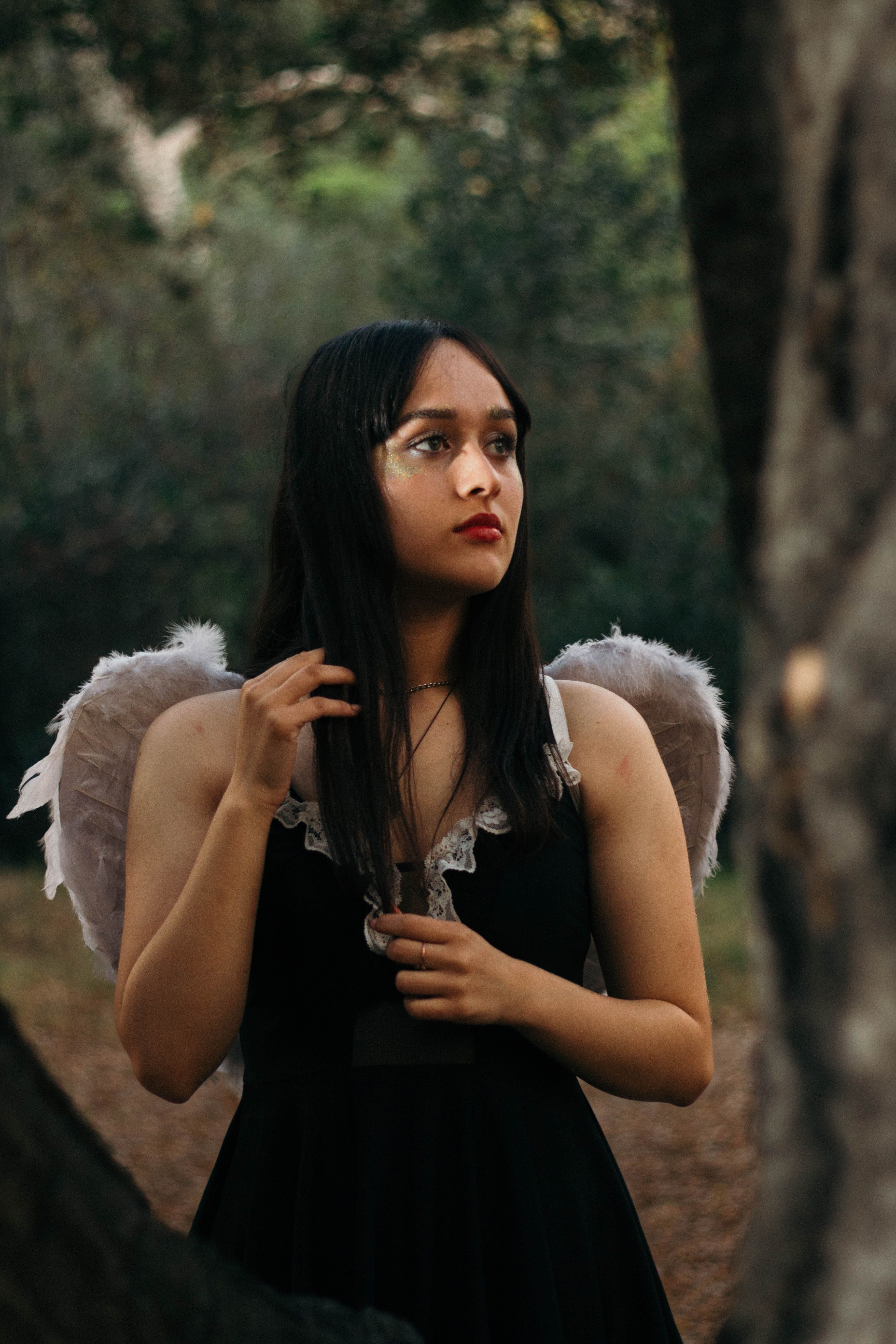 トリートユアセルフ angel wings long dress black A Woman in a Black Dress with Wings · Free Stock Photo