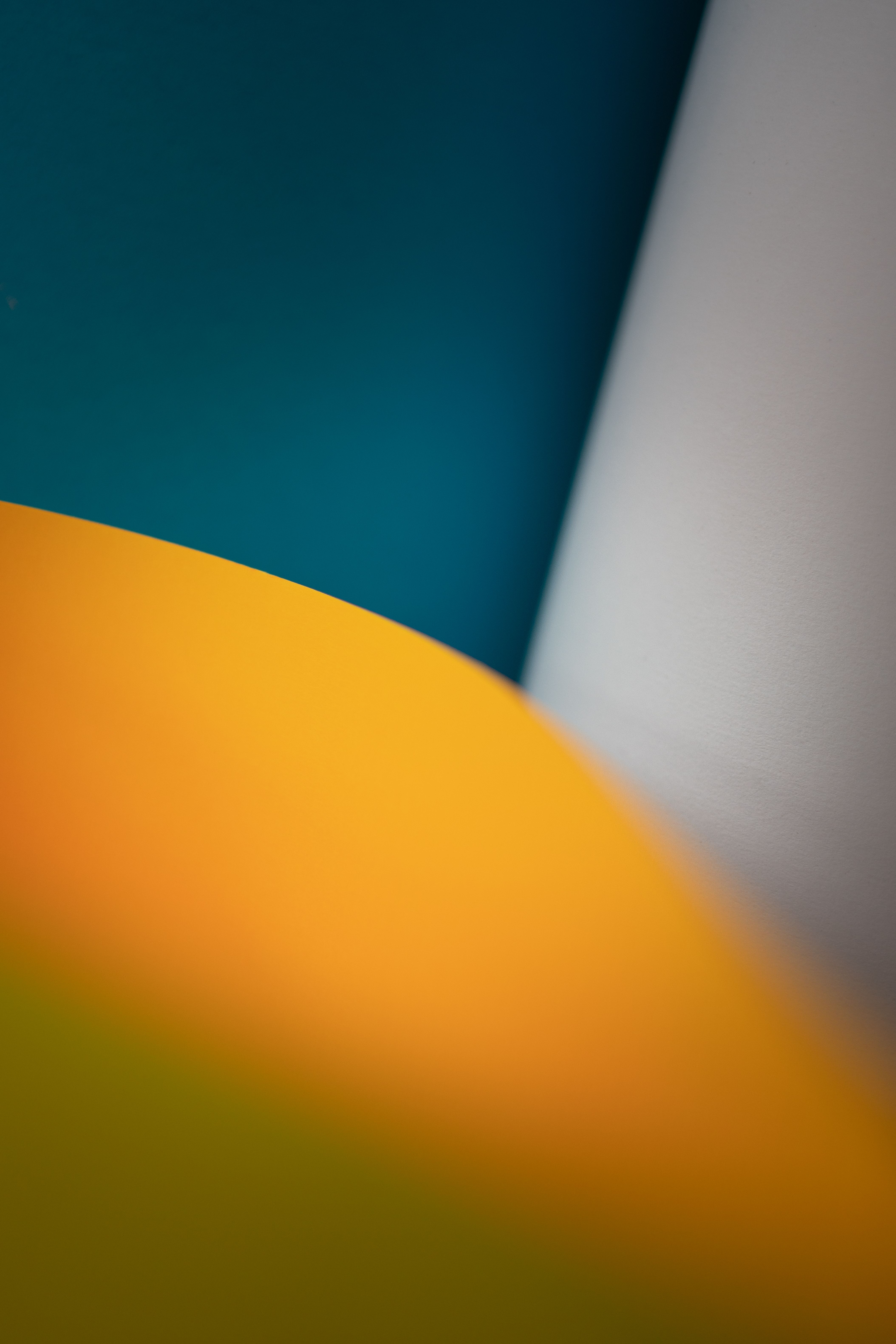 Vivid abstract image featuring blurred shapes with dominant blue and yellow colors.