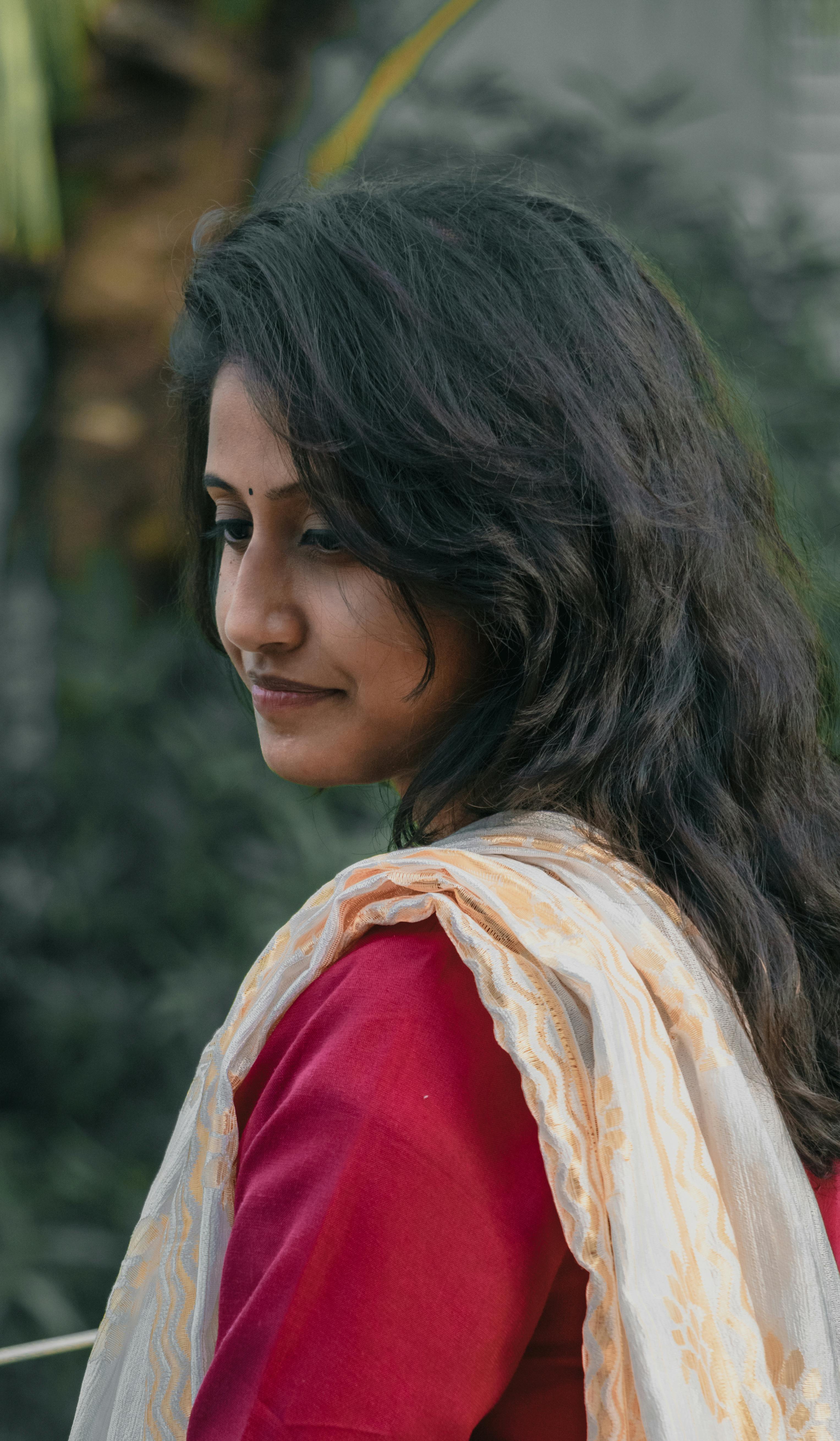 Portrait of a young woman wearing traditional attire, showcasing elegance and grace.