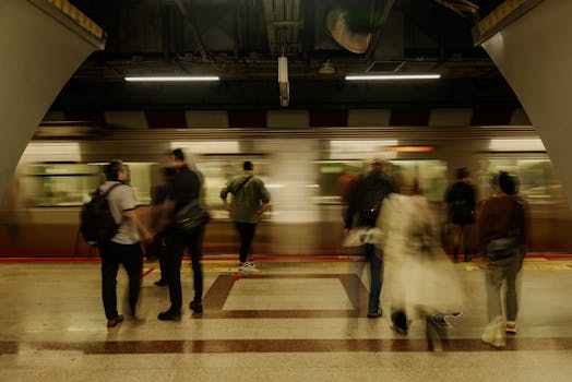 Blurred motion capture of busy commuters at an İstanbul subway station.