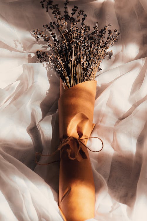 Dry Lavender Wrapped in Paper, on a White Drape