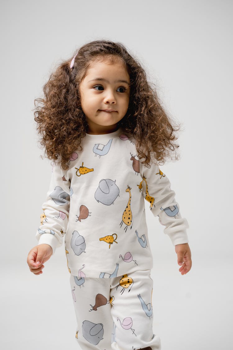 Child Posing In Pyjamas 