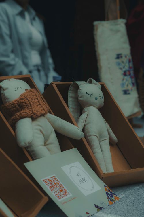 Free Two handmade soft toys showcased in stylish boxes with packaging elements. Stock Photo