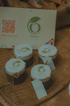 Elegant display of natural beauty products with olive branding on burlap, perfect for eco-conscious consumers.