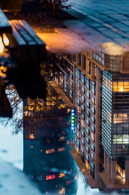 A stunning view of Vancouver's modern architecture reflected in water at dusk.
