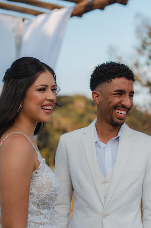 Portrait of Smiling Man and Woman in Wedding Dress and Suit