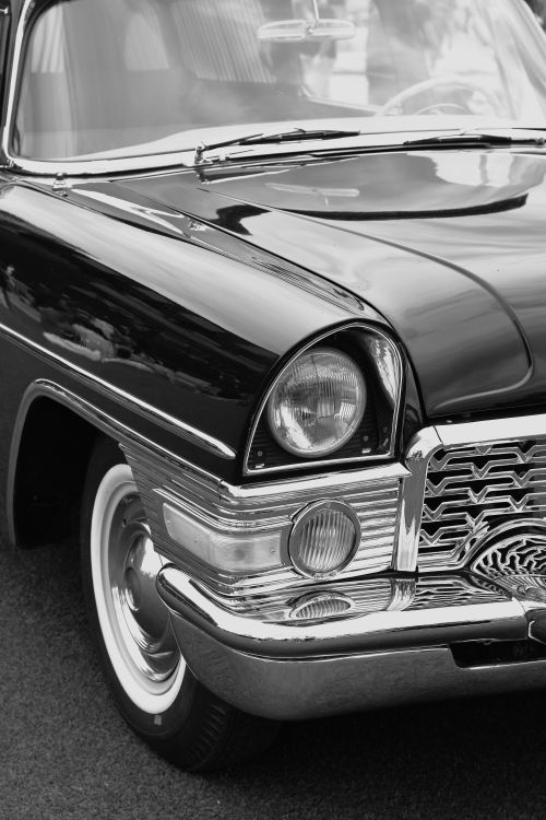 Free Elegant black and white close-up of a classic vintage car with chrome details. Stock Photo