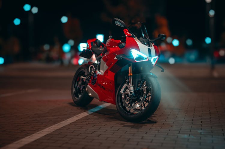 Red Motorcycle On A Street At Night 