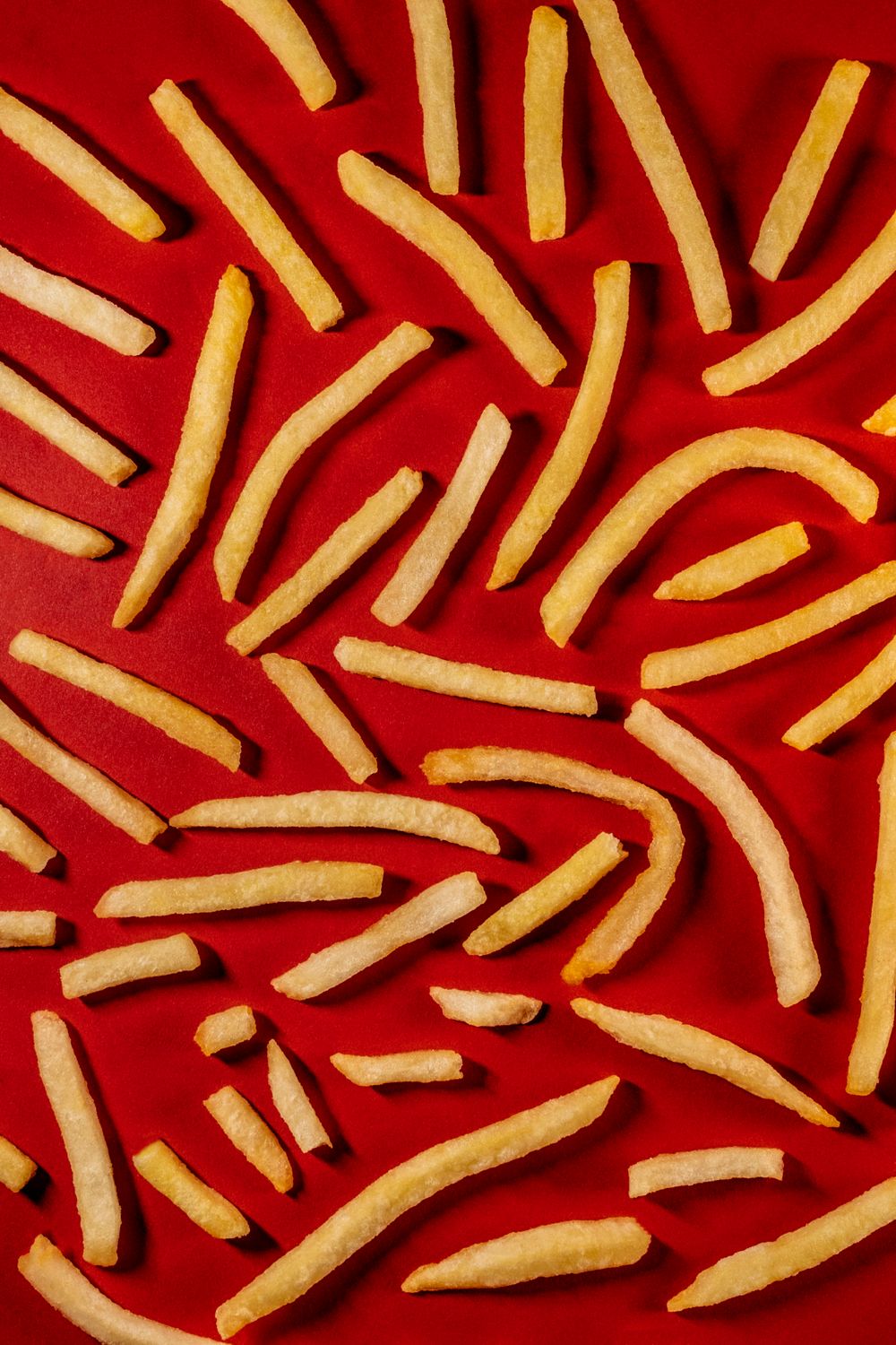 Red Color Fries Fries on Red Background · Free Stock Photo