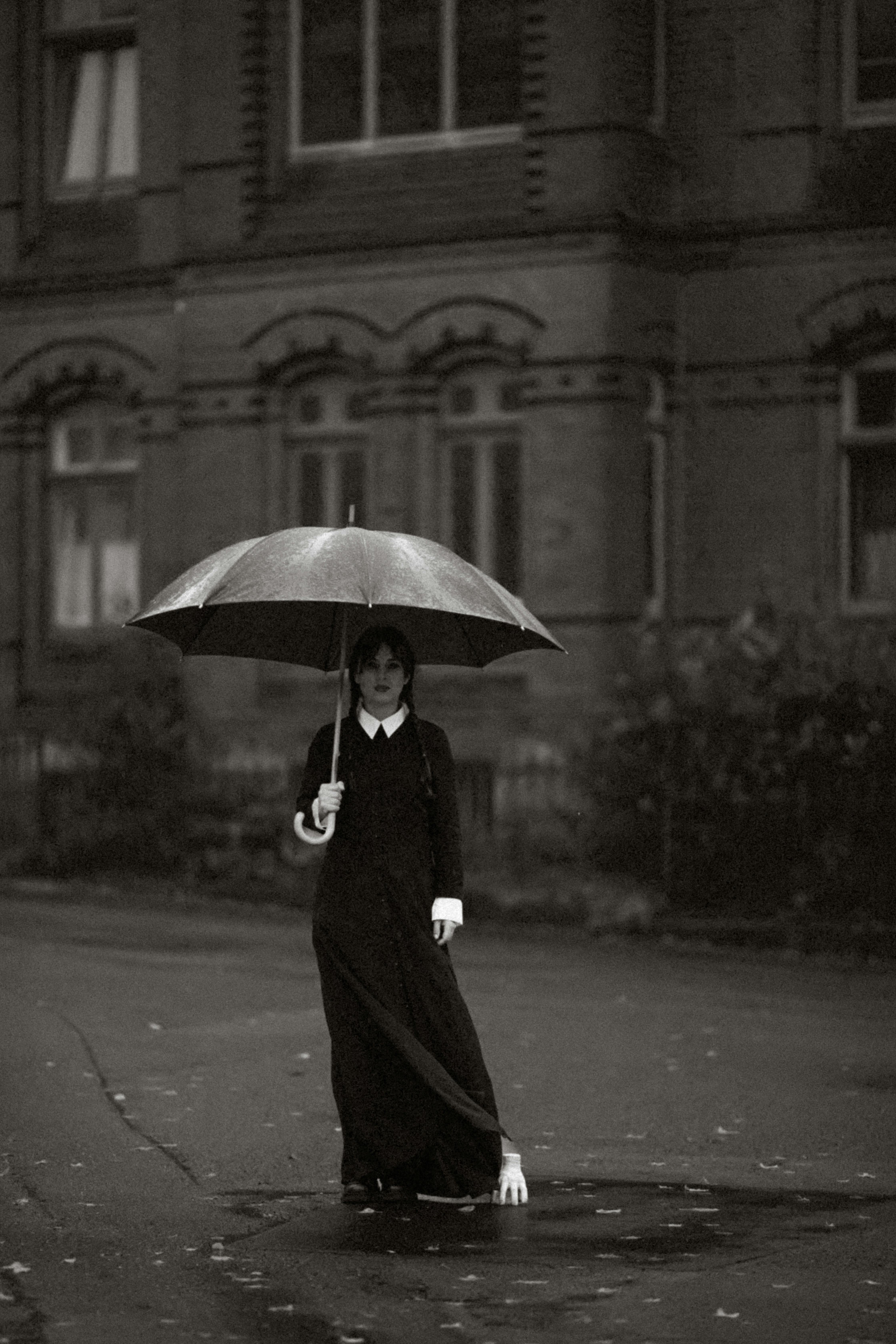 woman in wednesday addams costume in black and white