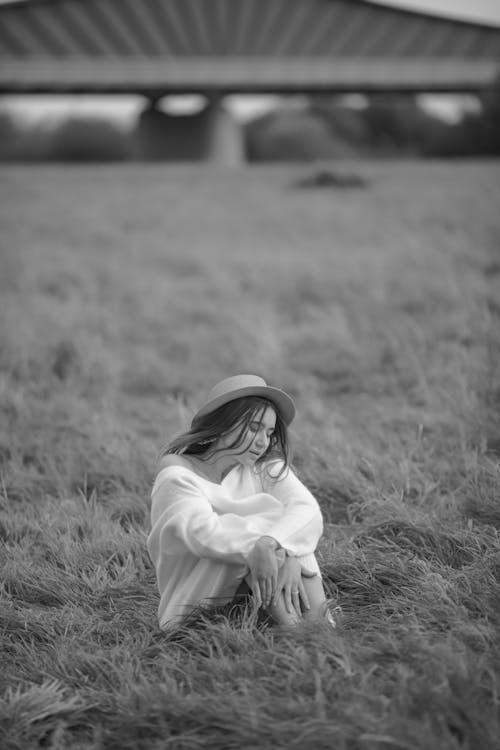 Woman Wearing Straw Hat on a Field in Black and White 