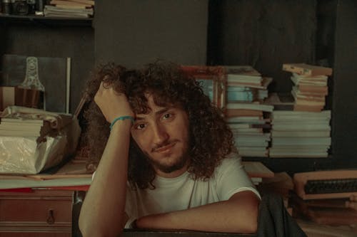 Young Man with Long Curly Hair
