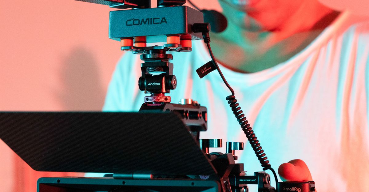 Operational Camera Man Operating a Professional Camera · Free Stock Photo