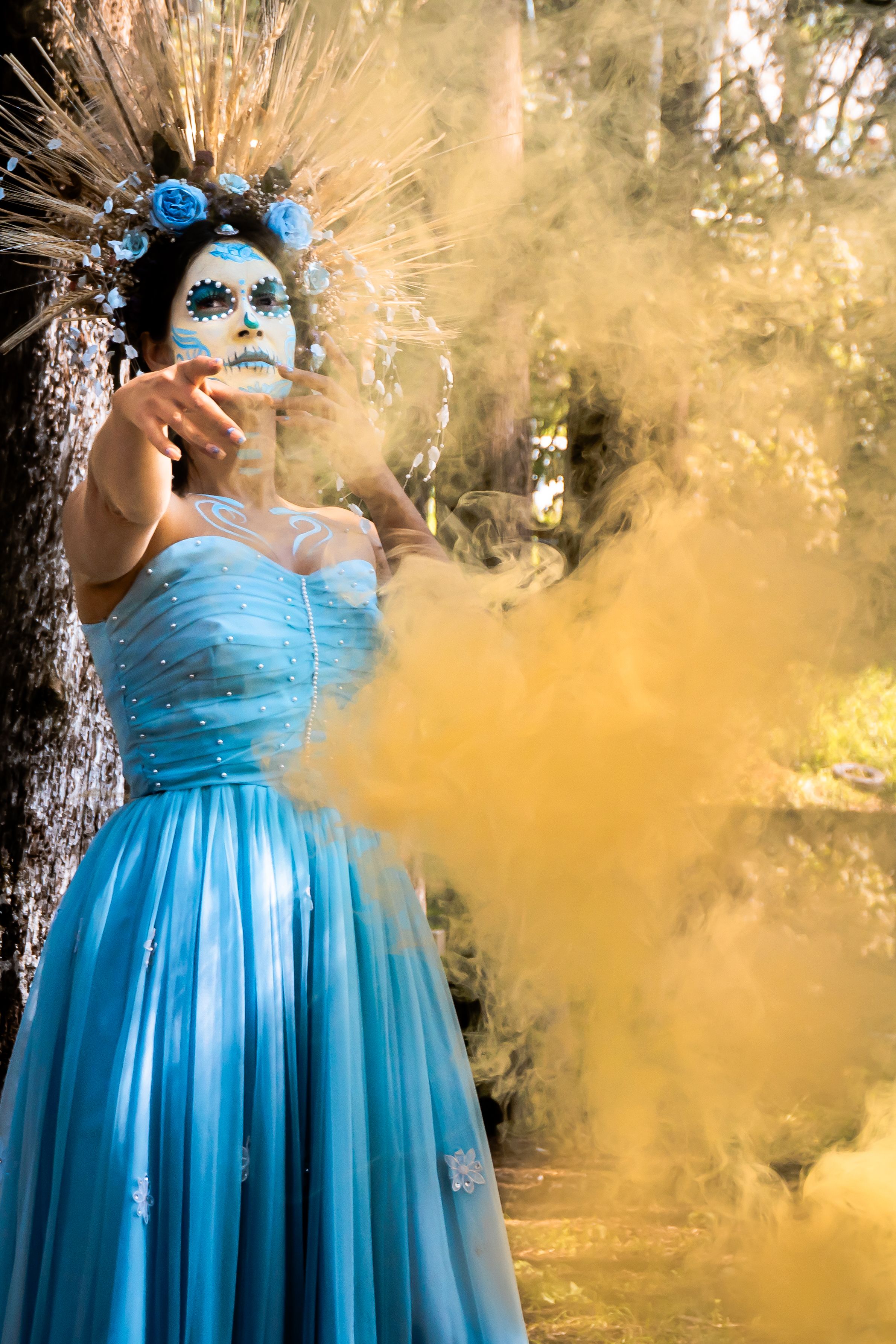 Catrina in a Blue Dress Among Yellow Smoke  Free Stock Photo