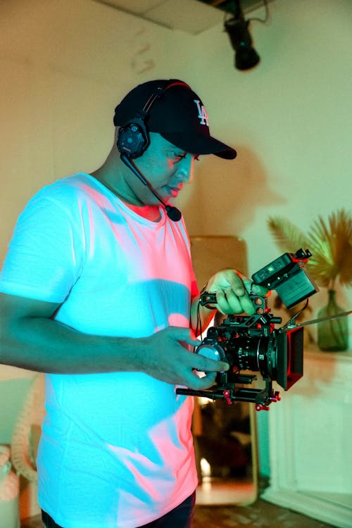 Man Operating a Professional Camera 