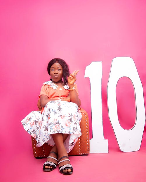 Girl Posing in a Pink Studio on her Birthday