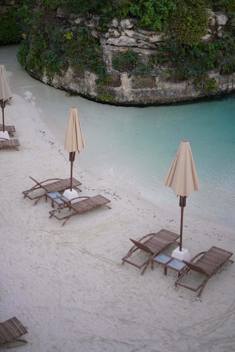 Deckchairs On Beach In Summer Resort