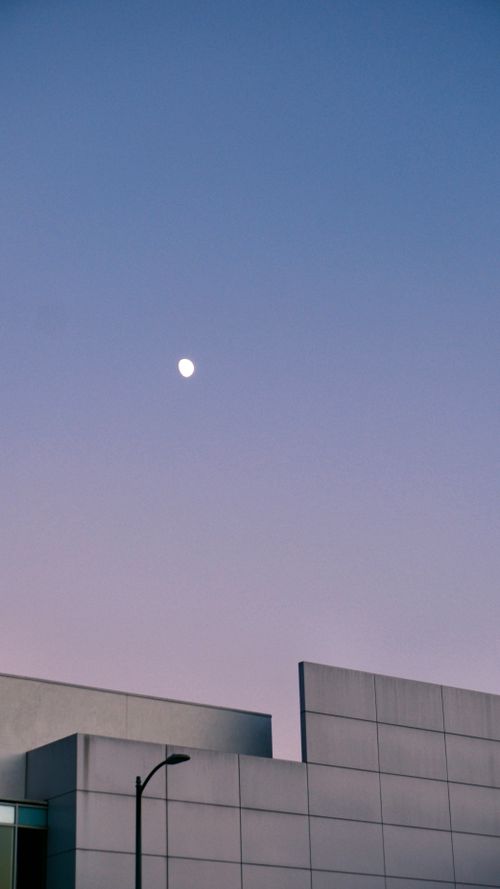 Free Minimalist modern architecture against a twilight sky with moon. Stock Photo